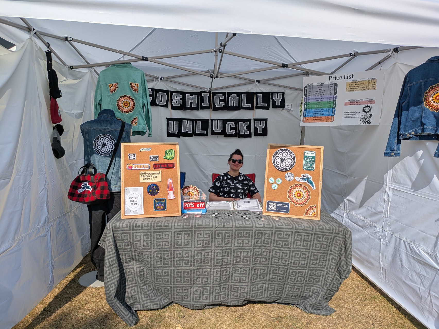 A photograph of the Cosmically Unlucky booth at Strathearn Art Walk
