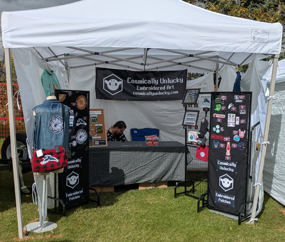 A photograph of the Cosmically Unlucky booth at Strathearn Art Walk